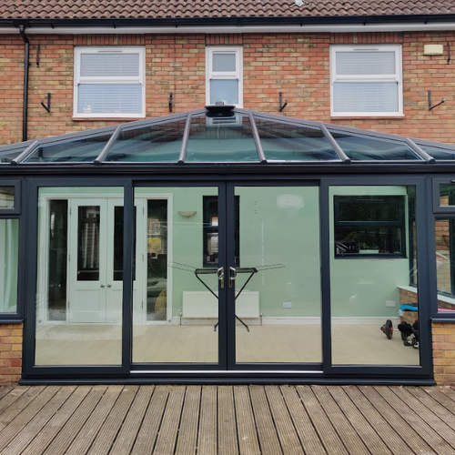 Black Patio Doors attached to a black framed glass conservatory